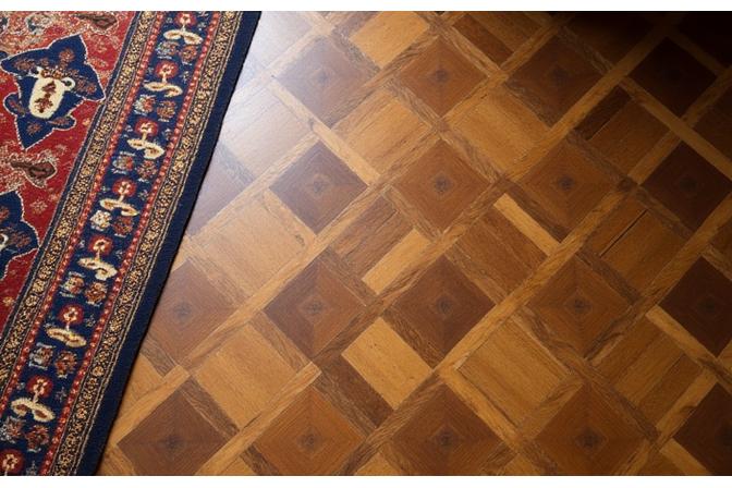 Restauration d'un parquet en marqueterie complexe dans un château historique